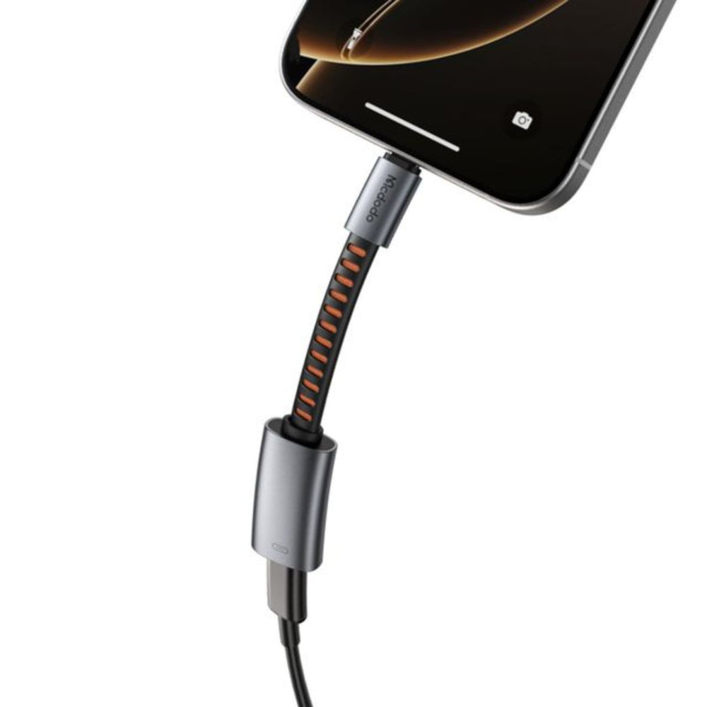 Silver USB-C adapter with black and orange braided cable on a white background